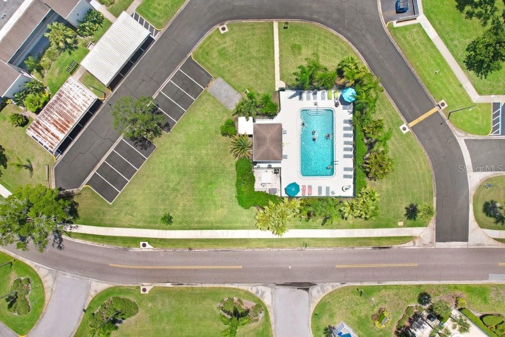 drone photo of the community pool well within walking distance from the condo