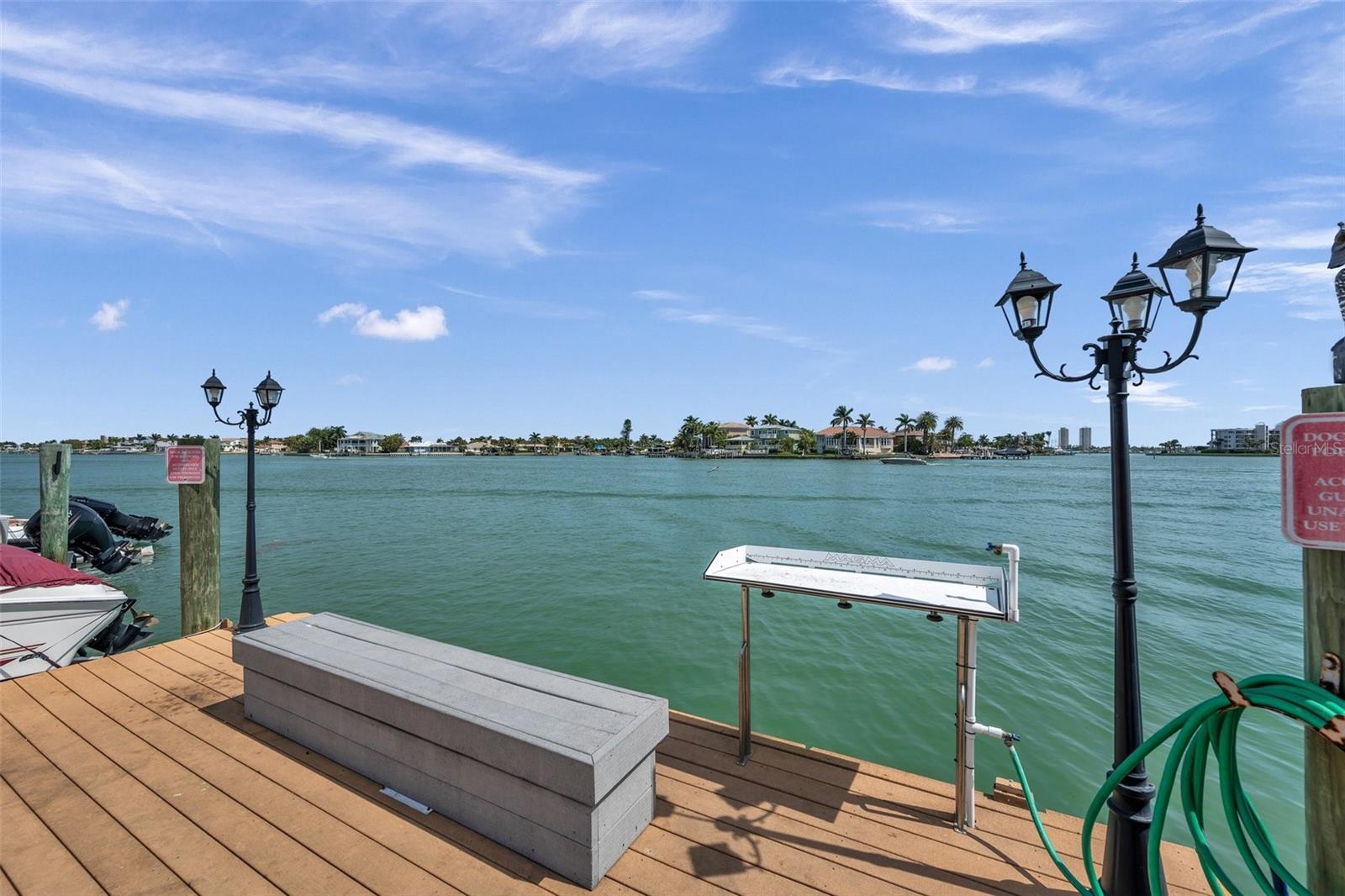 Fishing dock with cutting table and water for cleaning fish