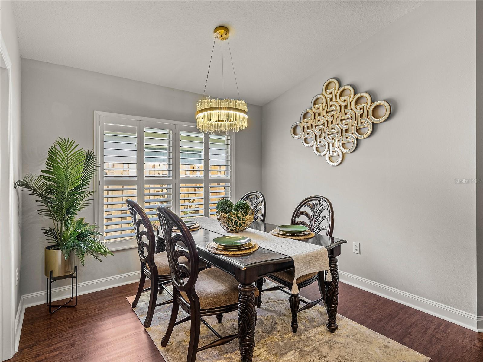 Dining with LVP Flooring and Plantation Shutters
