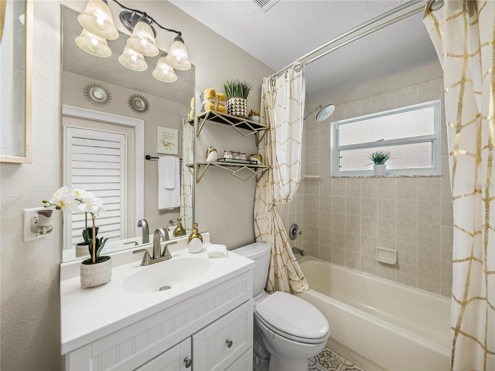 Second Remodeled Bath with Plantation Shutters and Gorgeous Tile Flooring