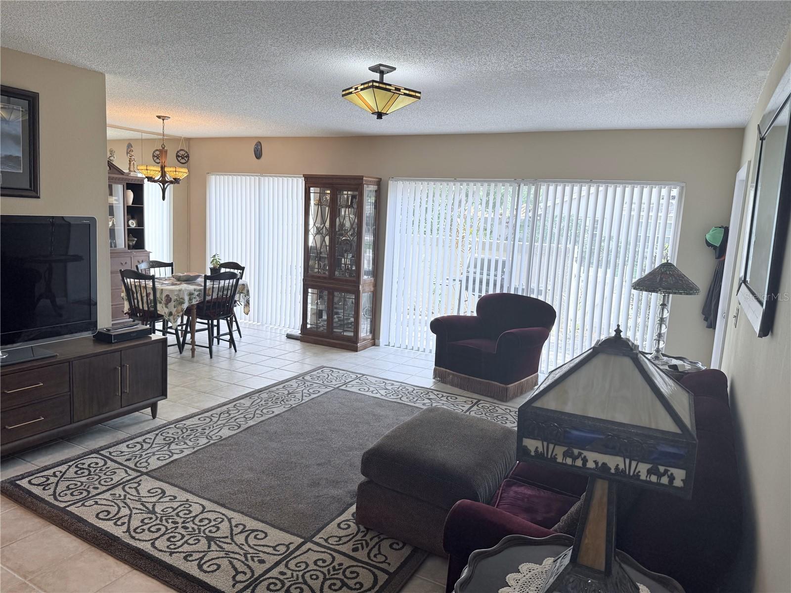 Living Room/Dining Room with 2 Sliding Doors to the Patio