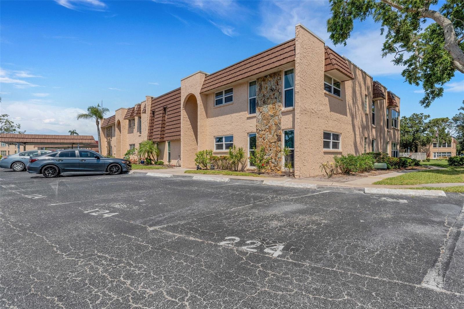 Front of Building and 2 Assigned Parking Spaces for Unit 224