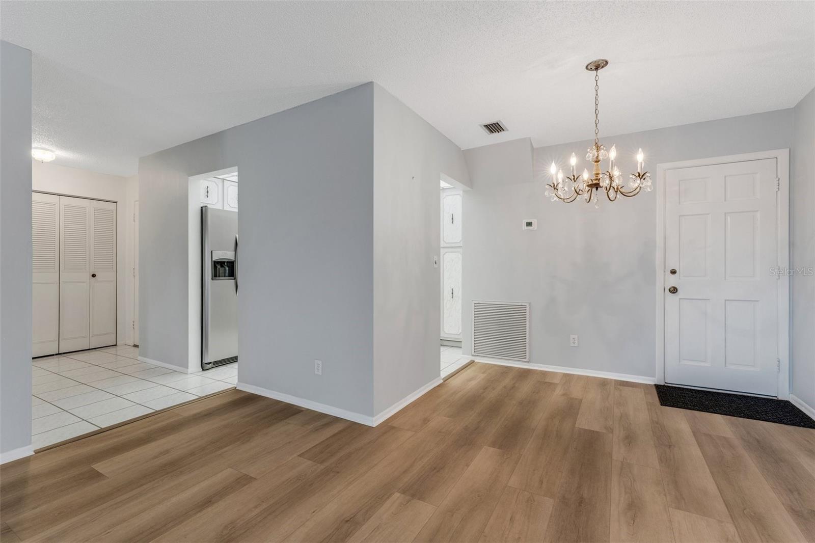 Dining Area with Pedestrian Door to Rear Stairway to Pool and Clubhouse