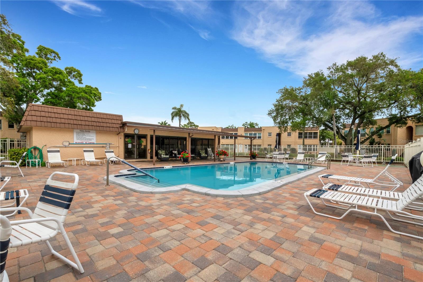 Pool with clubhouse & laundry rm in the background