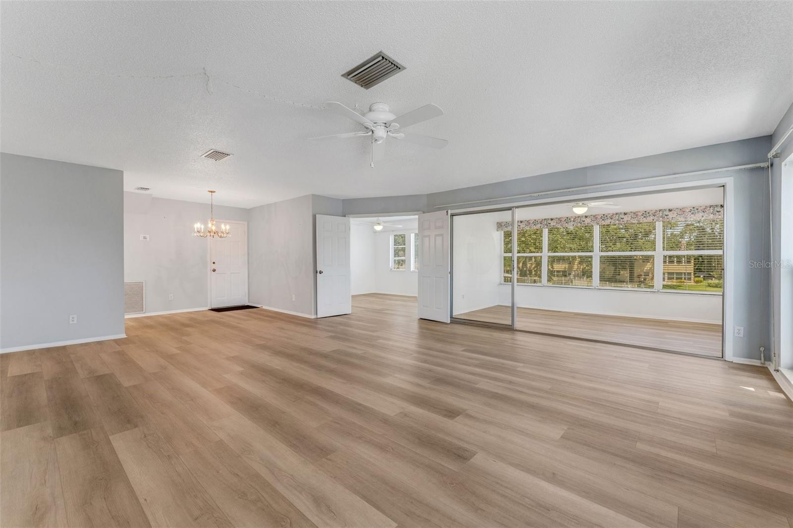 Living Room, Florida Room with Sliders and #rd Bedroom/Home Office