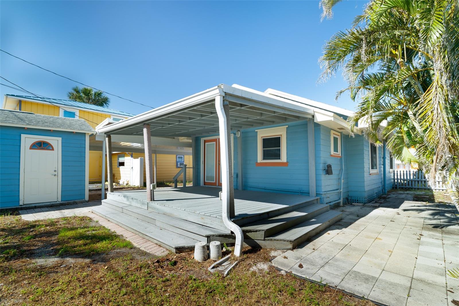 Covered rear porch and side entry to detached garage