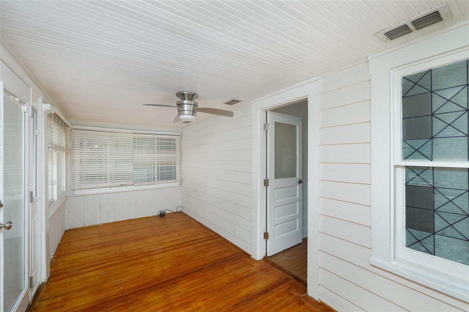 Former front porch converted to living space. Entry to living room