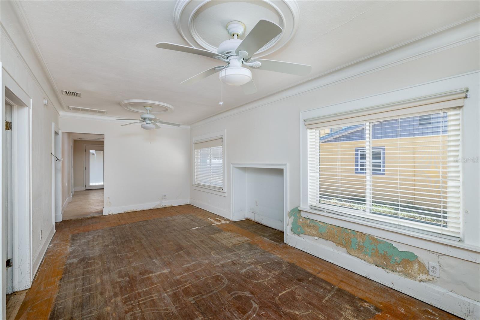 Partially remediated living room with fireplace