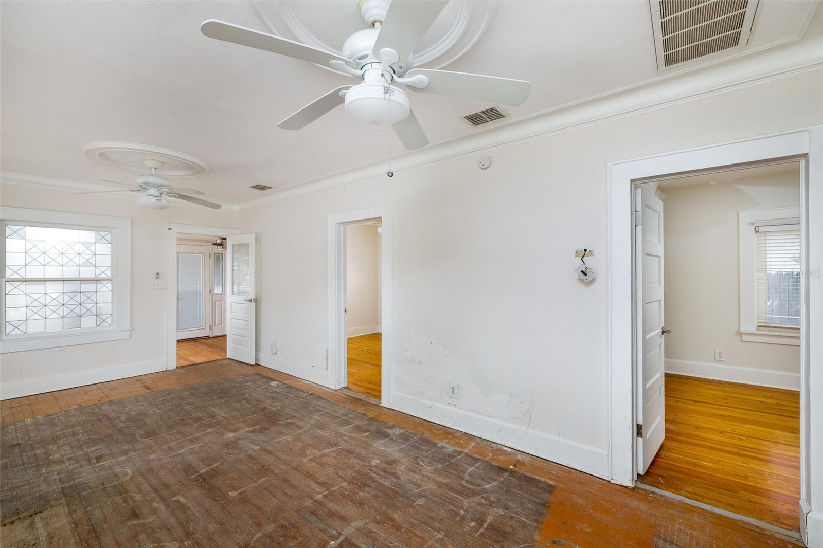 Partially remediated living room. Entries to bedrooms.