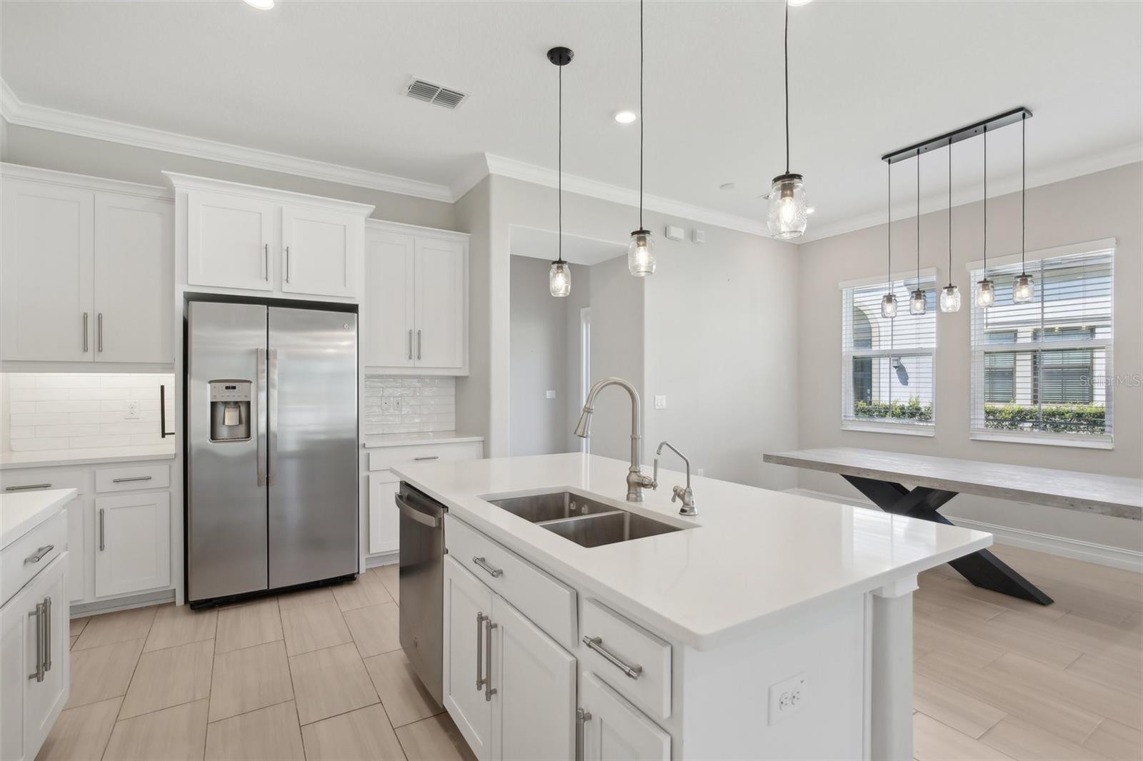BRIGHT, OPEN KITCHEN LENDS TO PLENTY OF SPACE FOR ENTERTAINING