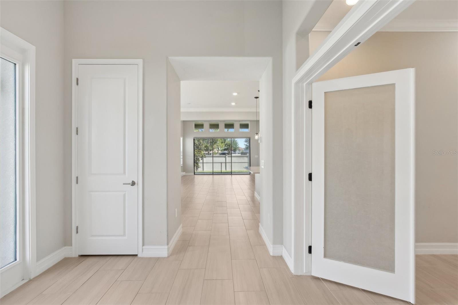 BEAUTIFUL OPEN FRONT ENTRY. DOUBLE DOORS LEAD TO OFFICE/DEN AND HALL LEADS TO MAIN LIVING AREA