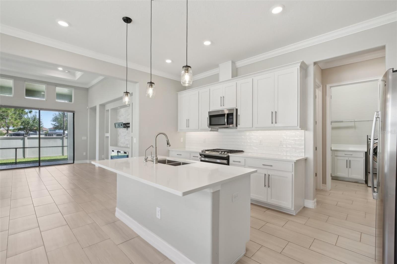 BRIGHT, OPEN KITCHEN LENDS TO PLENTY OF SPACE FOR ENTERTAINING