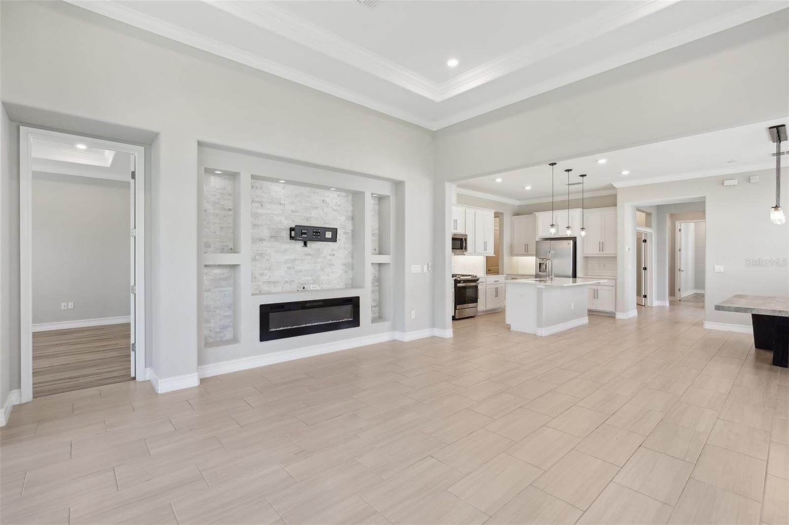 BRIGHT, OPEN KITCHEN LENDS TO PLENTY OF SPACE FOR ENTERTAINING IN THE LIVING ROOM. ADDITIONAL ROOM FOR SEATING AT THE ISLAND!