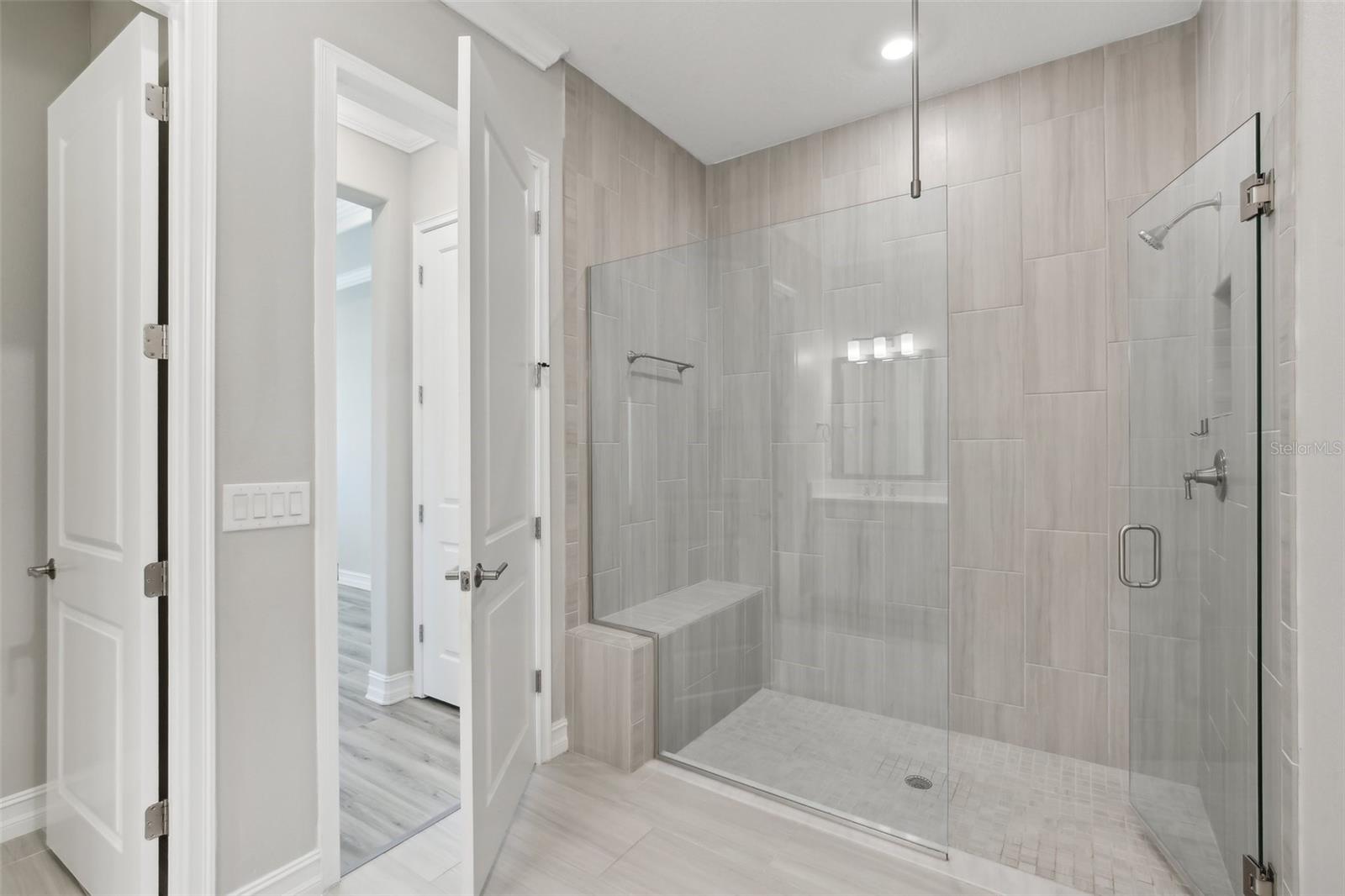 PRIMARY BATHROOM-HAS LARGE WALK-IN SHOWER WITH BUILT-IN SEATING