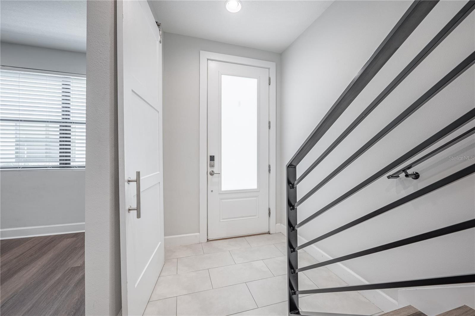 front door and hallway from garage