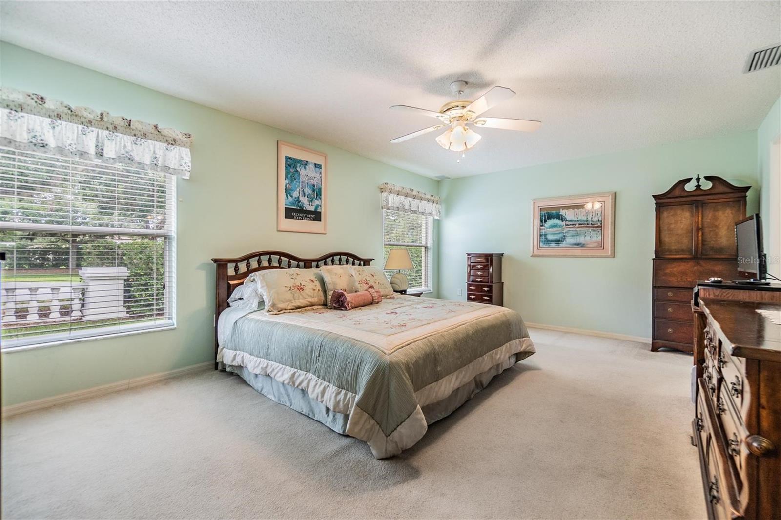An oversized master bedroom with enough room for a cozy reading nook