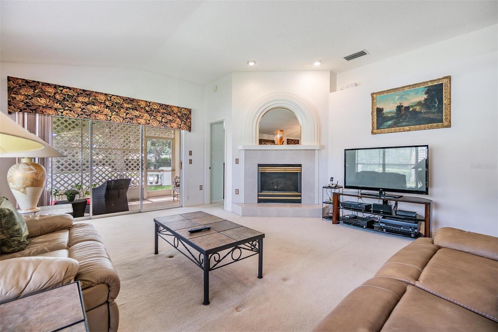 Large sliding glass door leads to lanai