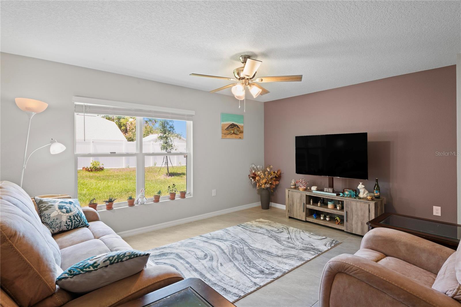 Living room enhanced by outdoor view.