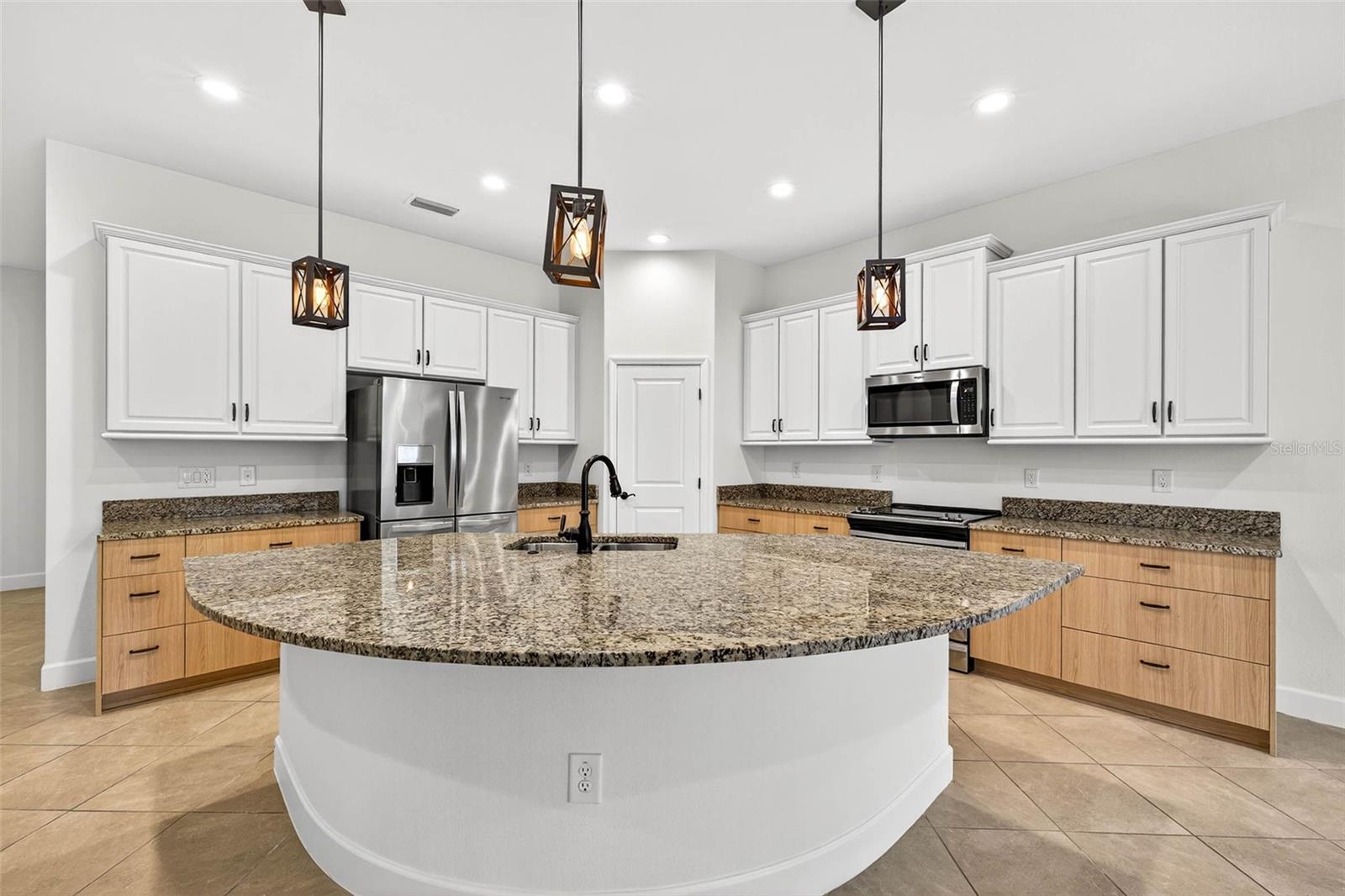 Kitchen updated with NEW cabinetry with pull out shelves, granite countertops