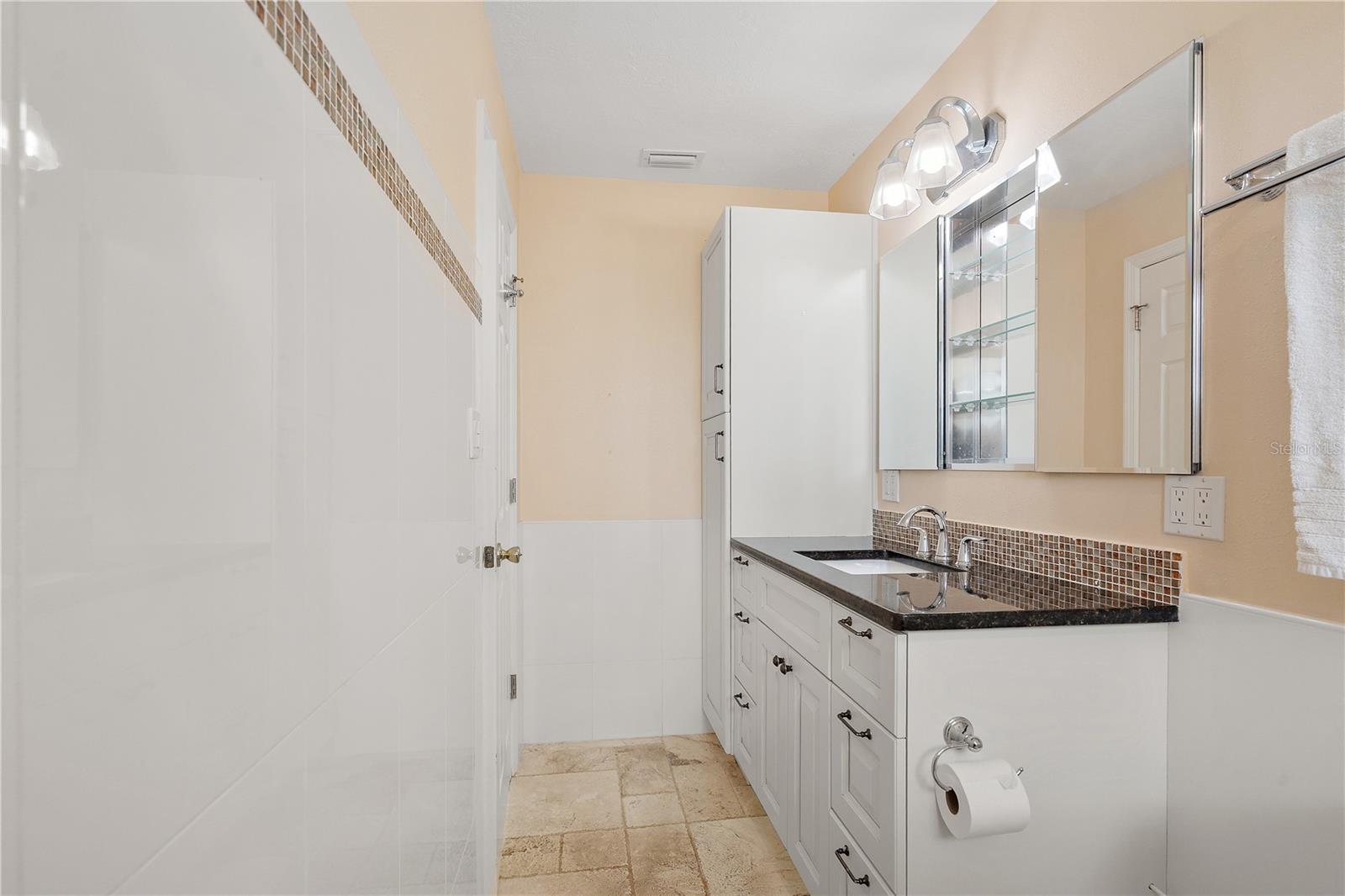 Primary bath features linen cabinet
