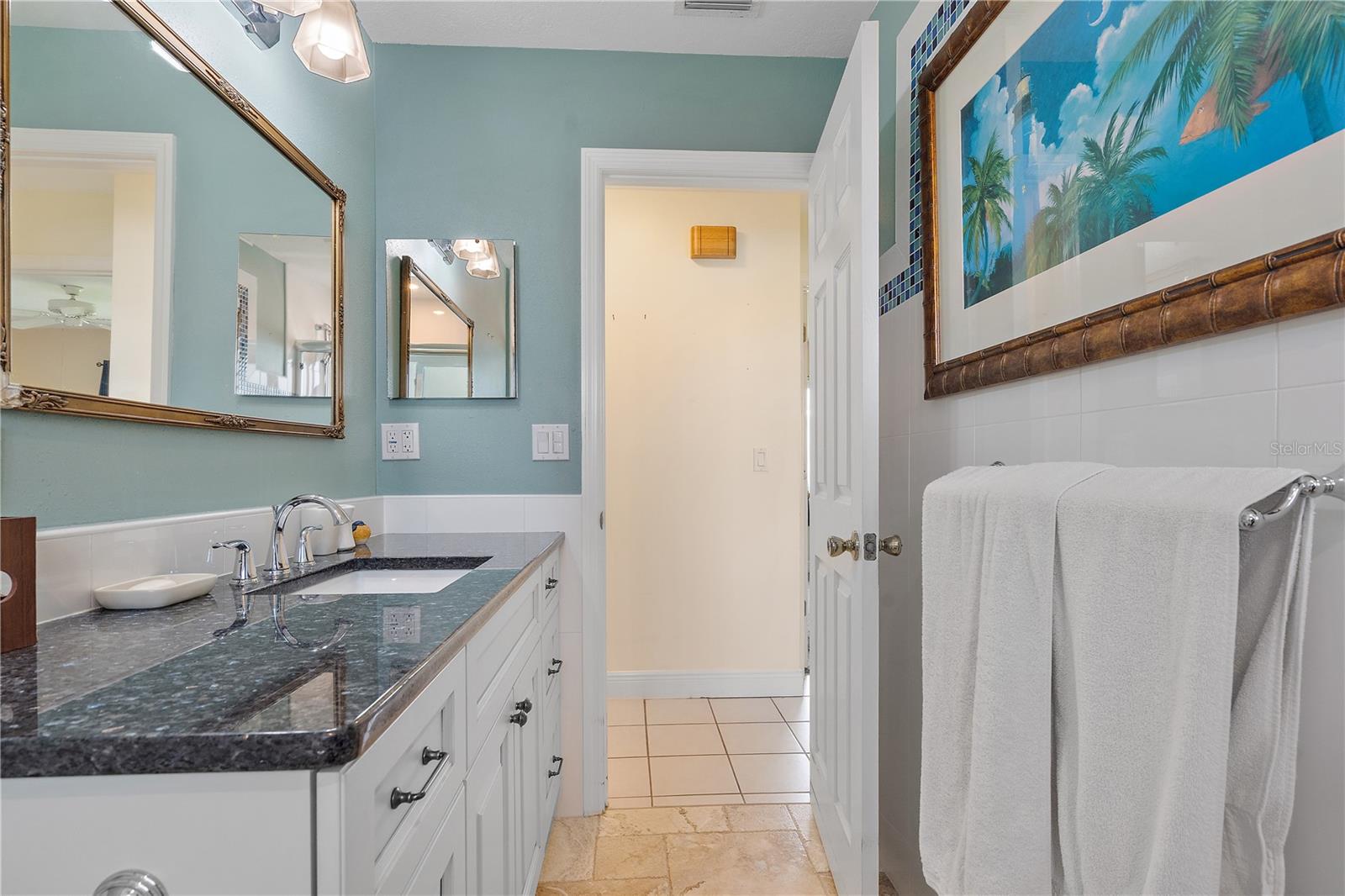 Hall bath with beautiful Florida art