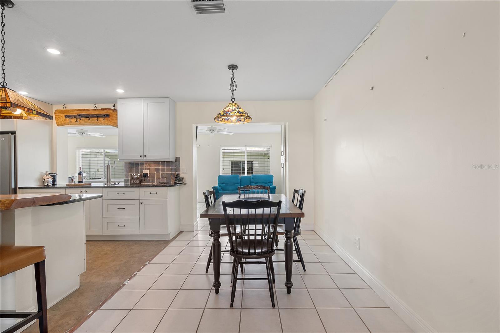 Dining area connects living room and kitchen