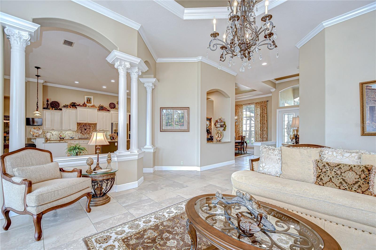 Formal Living Room Columns Divide Kitchen, Open to Dining Room and Foyer - Butlers Pantry Pass Through
