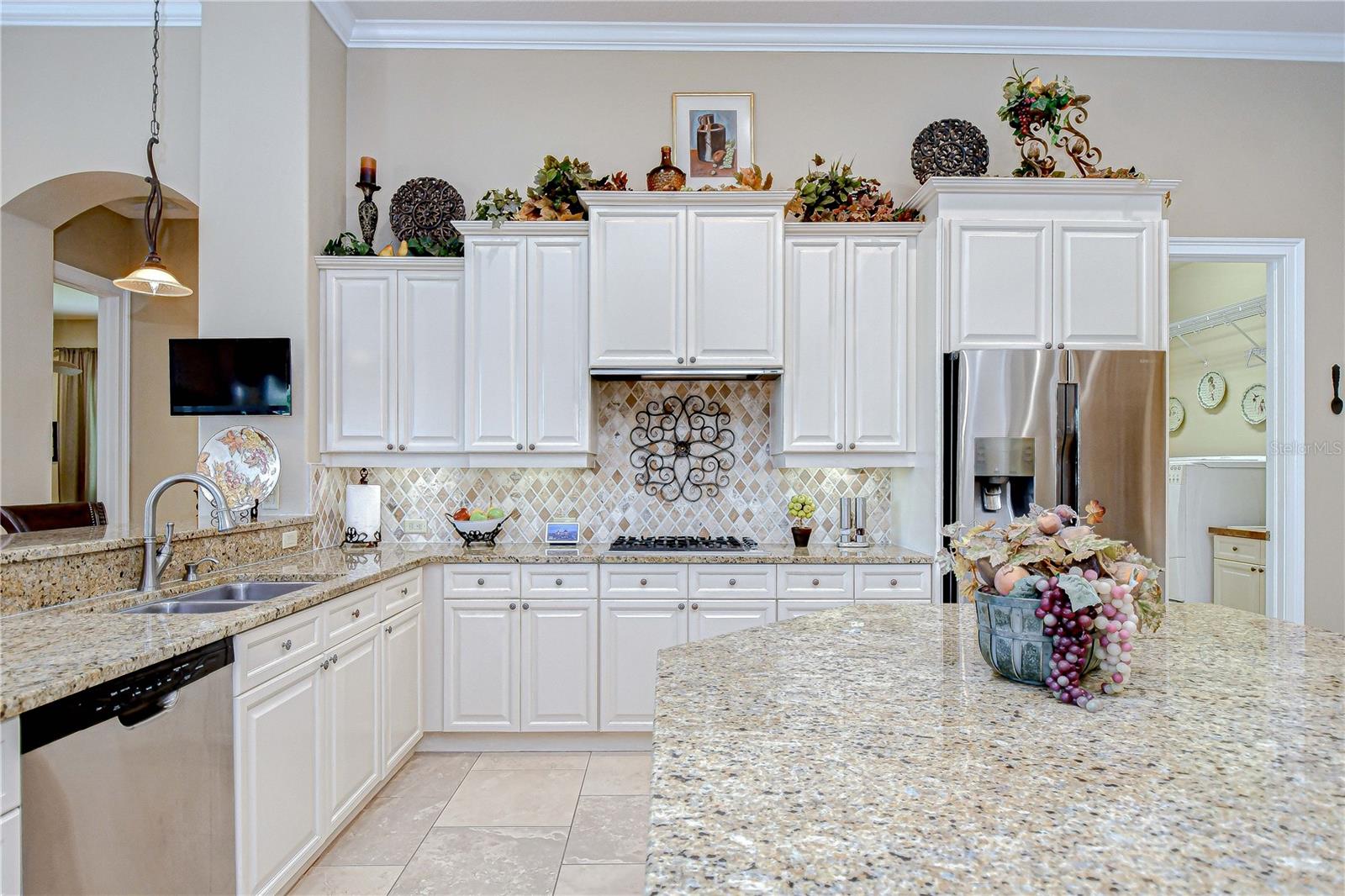 Kitchen Tall Beige Wood Staggard Cabinets with Crown, Granite Counters, Breakfast Hi-Bar, Pendant Lighting, Center Island