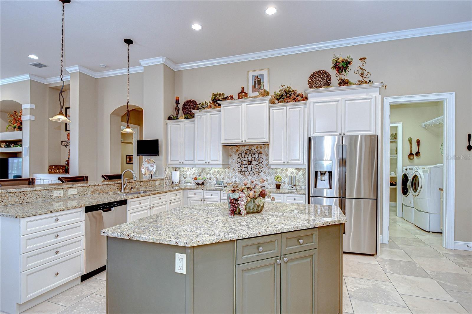Kitchen, Center Island, Laundry Room Off Kitchen, and Storage Room Beyond