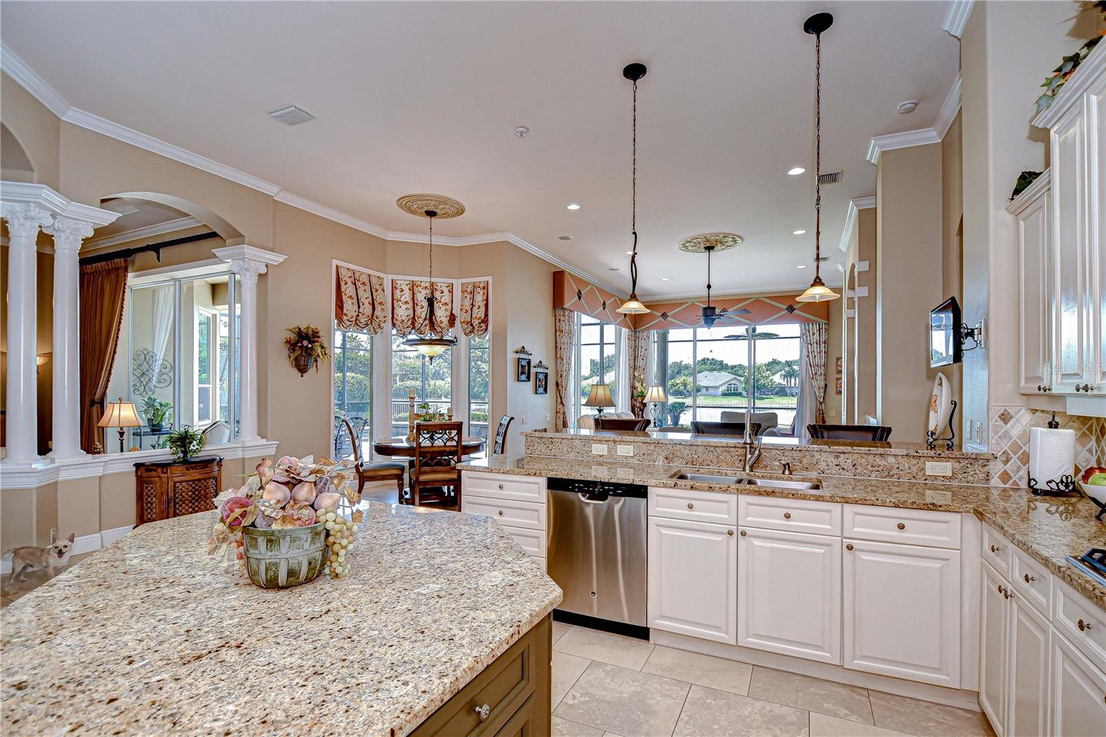 Kitchen to the Cafe Area, Hi Bar for Casual Dining or Entertaining, and Family Room Beyond, Lake View