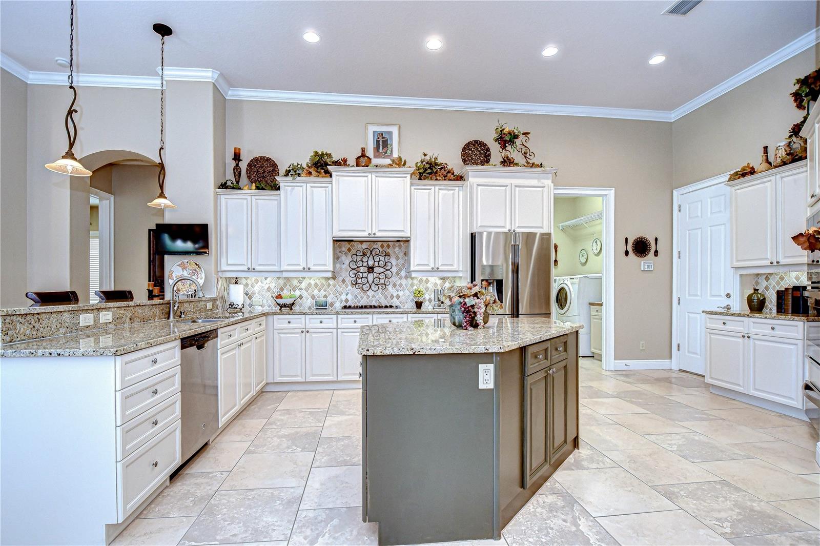 Kitchen Displaying Abundant Counter Space, Built-in Wall Oven and Microwave