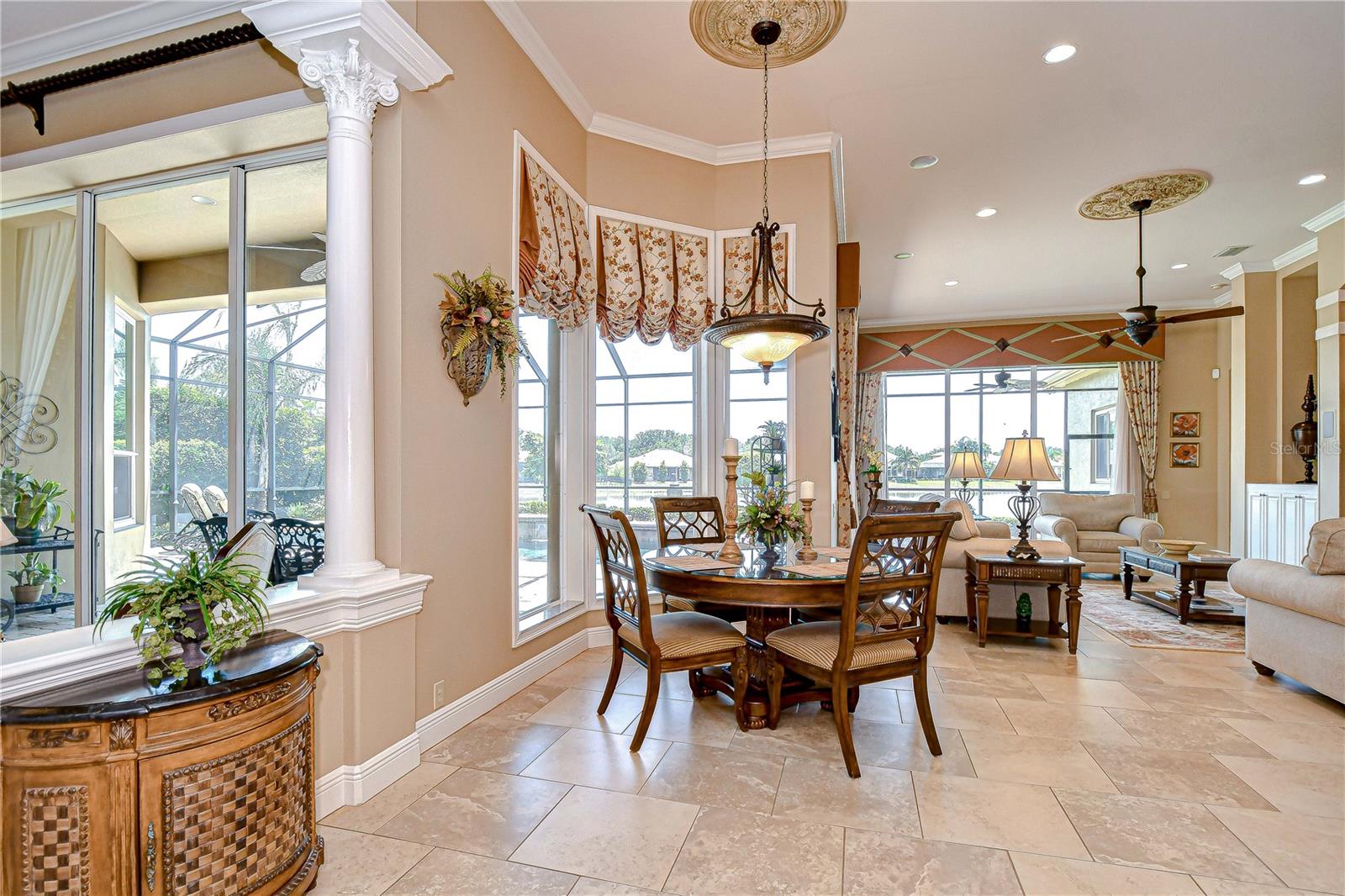 Cafe open to Family Room with Entertainment Center, Triple Windows 90 Degree Angle, Custom Window Treatments