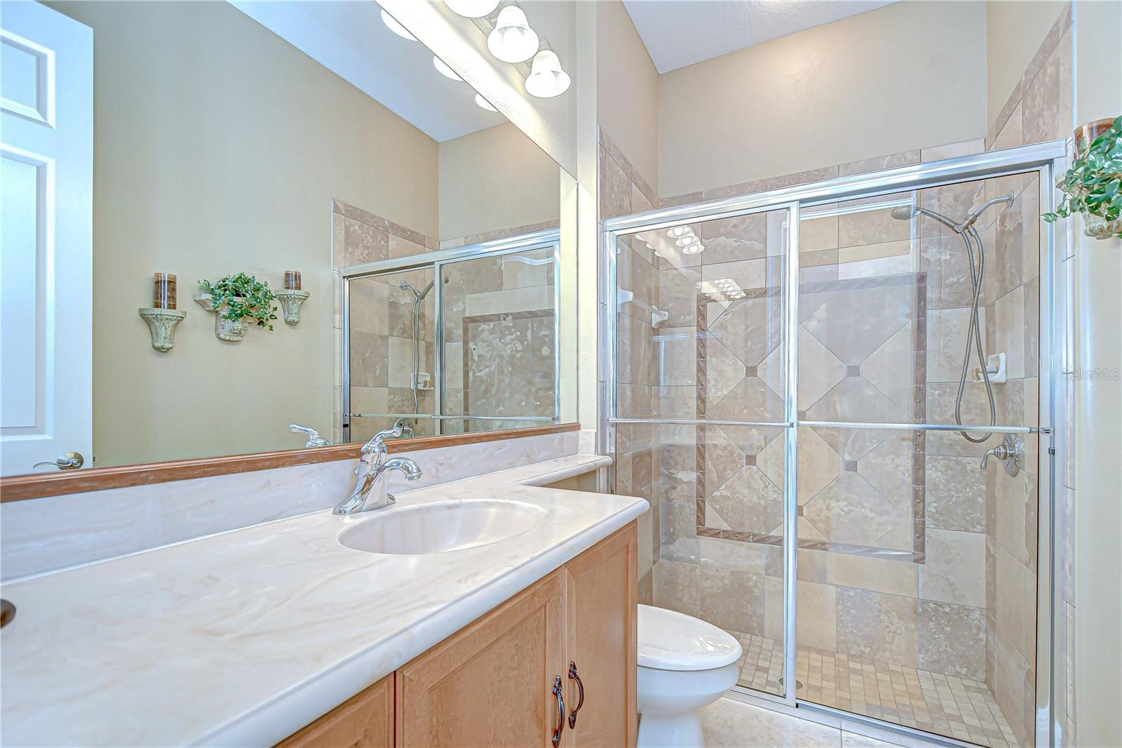 Bathroom 2 of 3.5 with Tiled Shower, Sliding Glass Doors