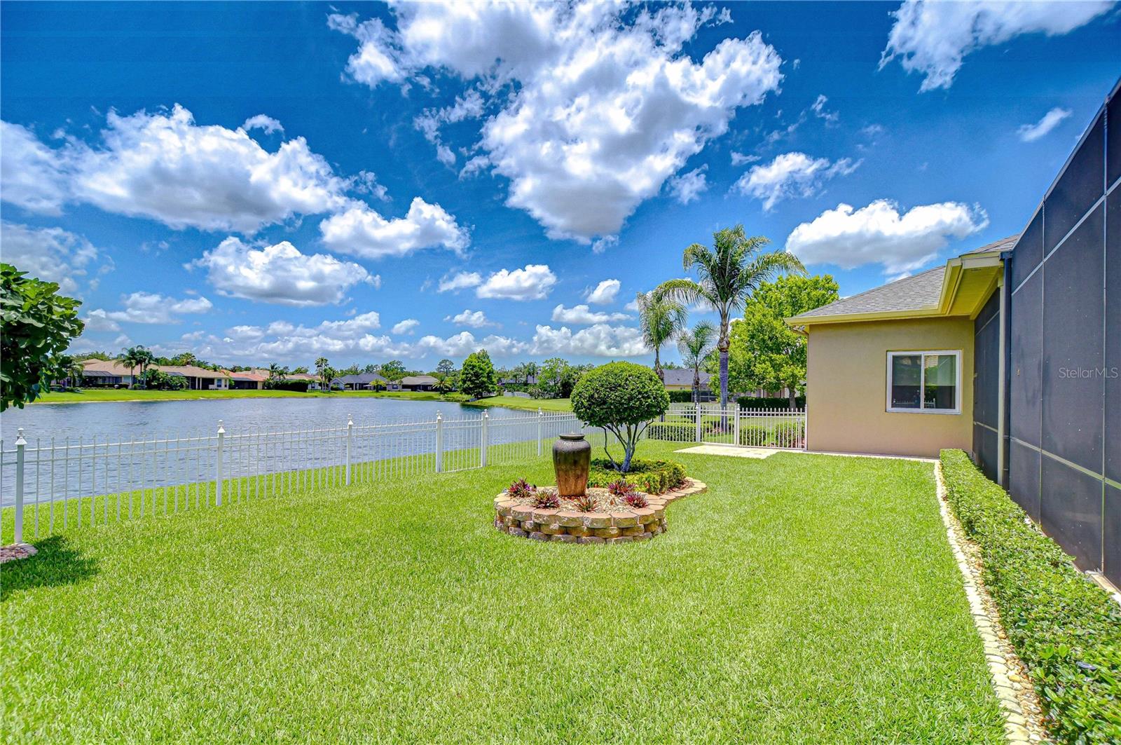 Lakefront with Landscape Island Waterfall Feature