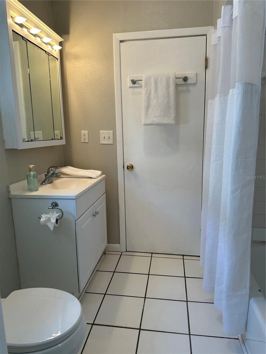 Jack & Jill bath has tub with shower