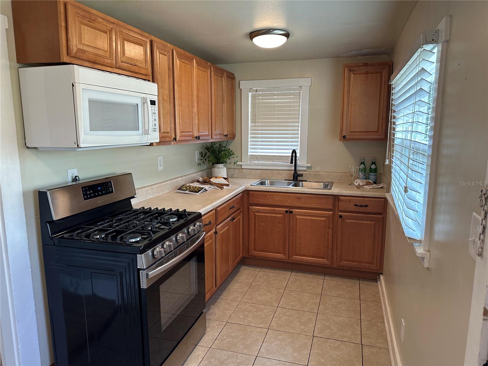 Galley Kitchen has plenty of space and there is a closet with washer dryer hookups.