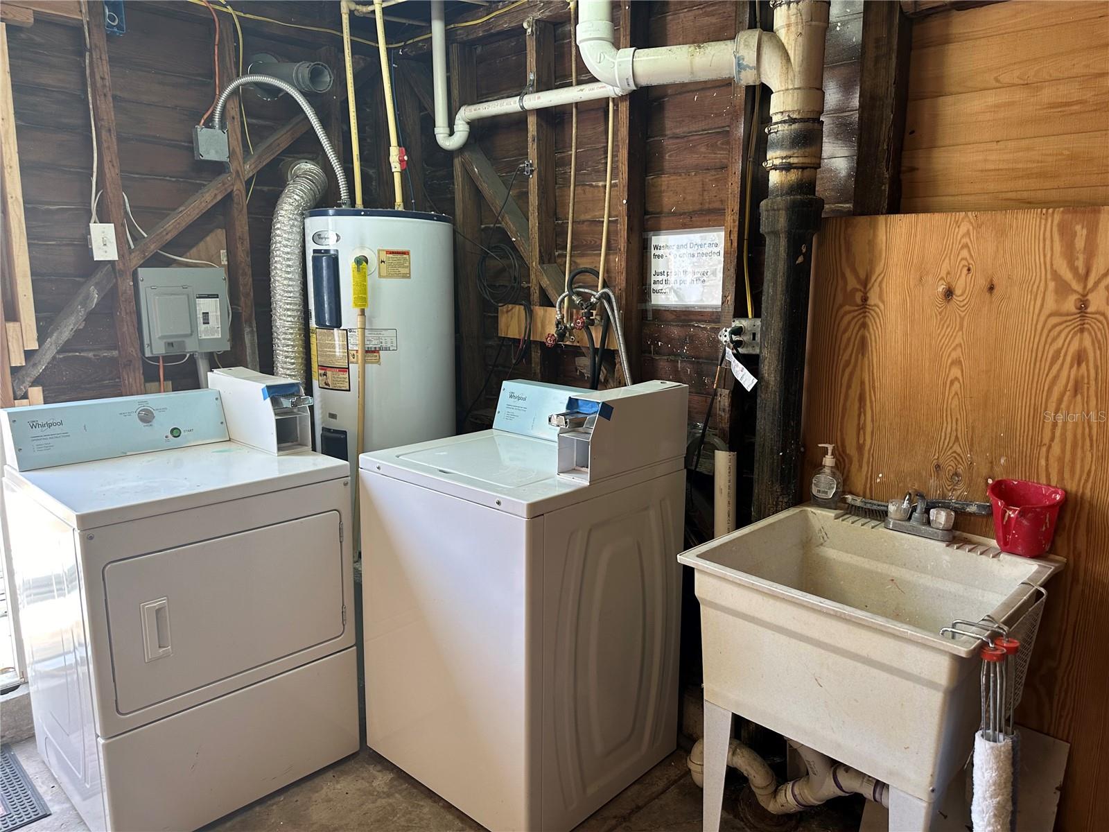 There is a laundry room set up in the carriage house/garage.