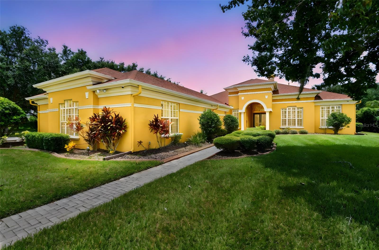 Twilight photo of the front of the home.