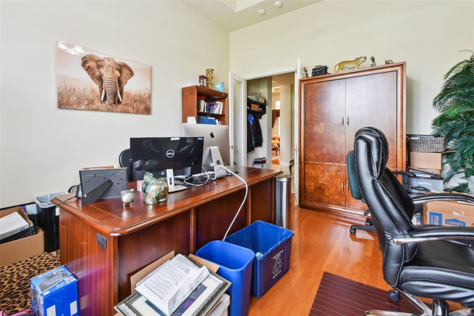 Office with hardwood floors at the front of the home.