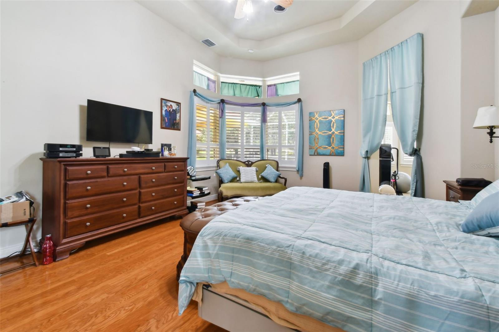 Master bedroom with views out to the pool.