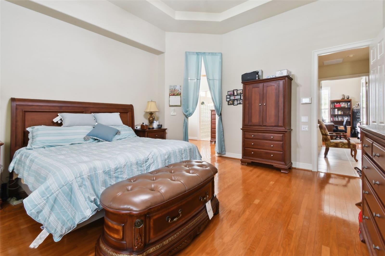 Master bedroom with access through to the walk-in closets and en-suite.