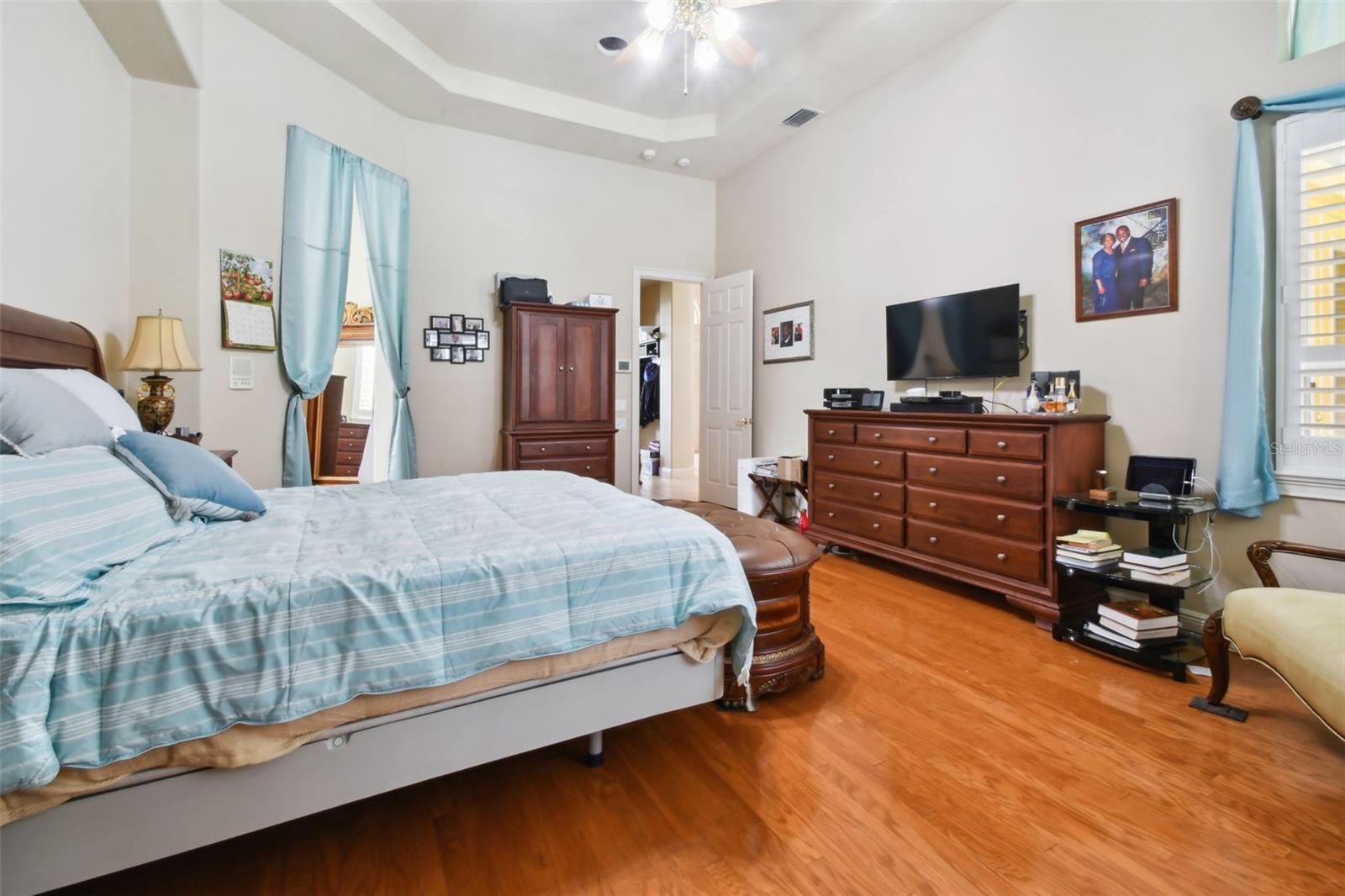 Master bedroom with tray ceiling.