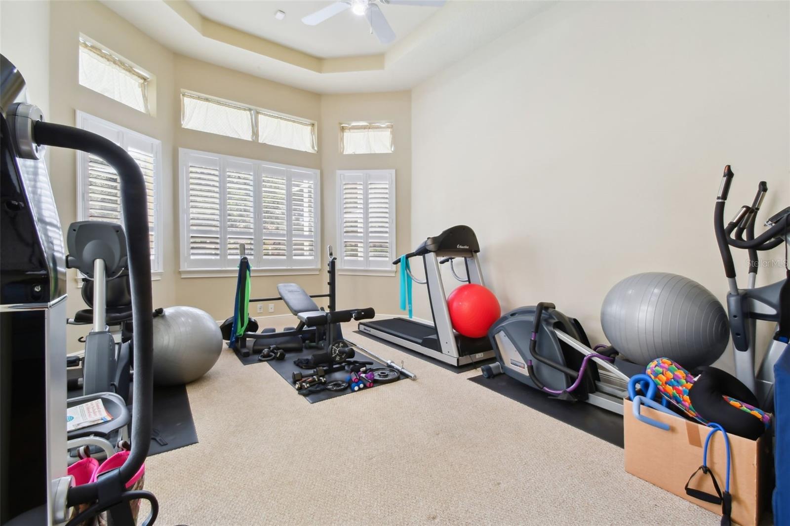 Gym area off the master bedroom with pool access.