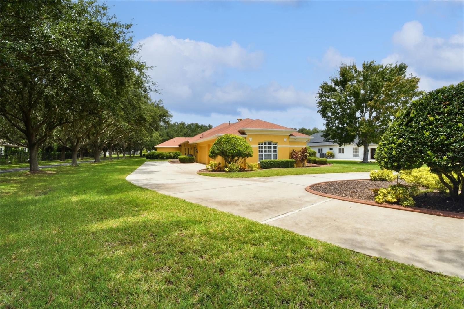 View towards the driveway and 4 car garage.