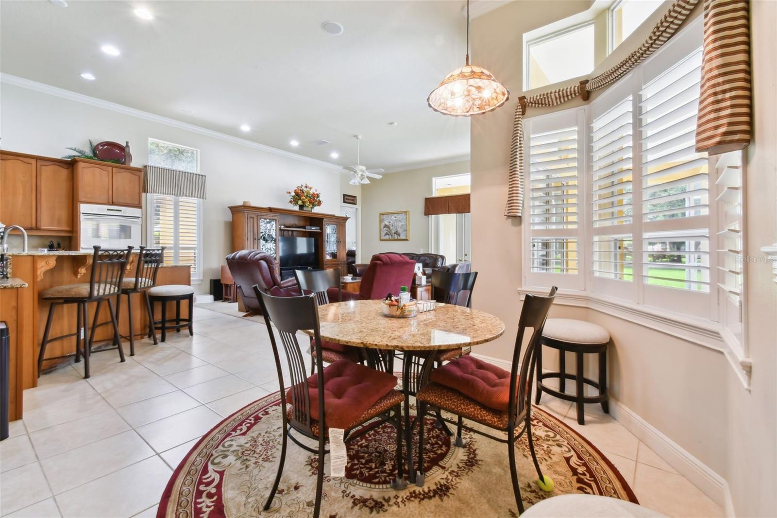 Breakfast nook with kitchen and living room views.