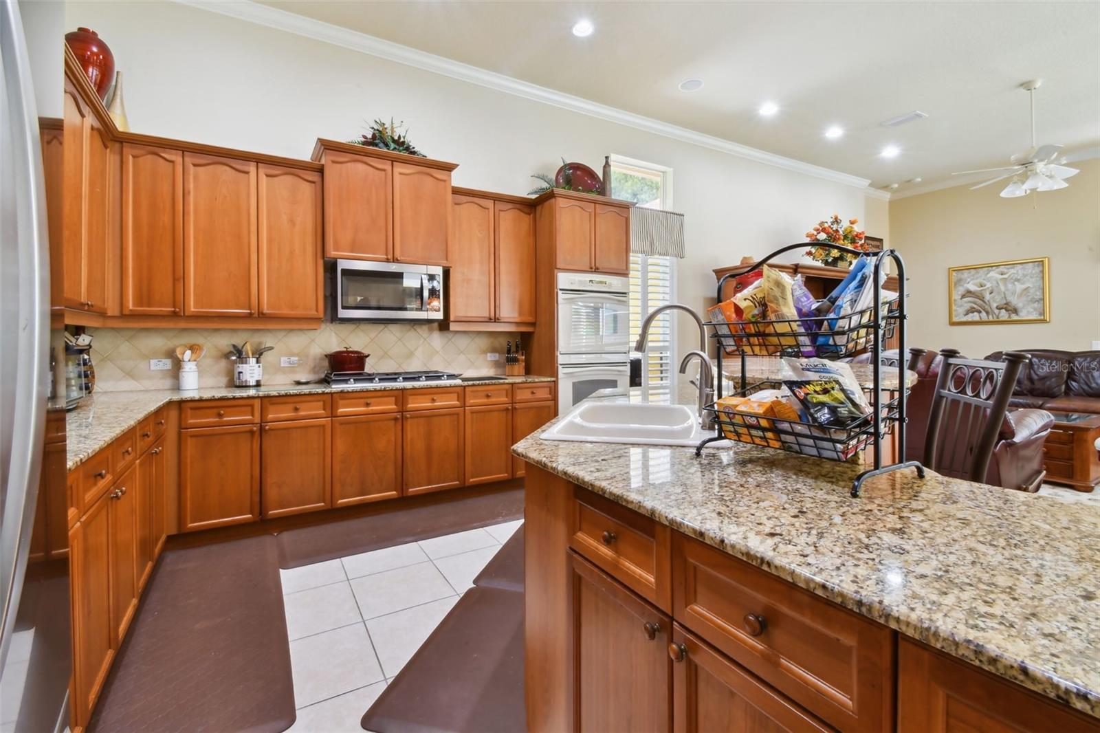 Kitchen with gas stovetop and double ovens.