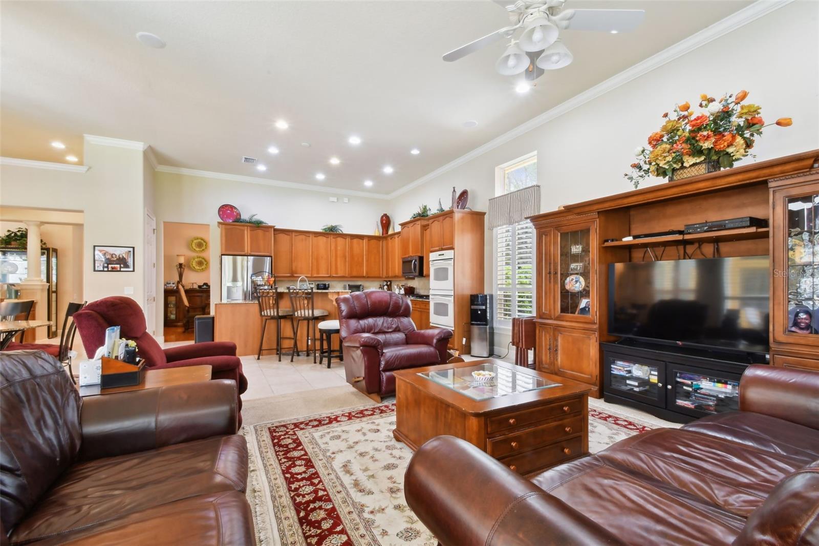 Living room and view of the kitchen.