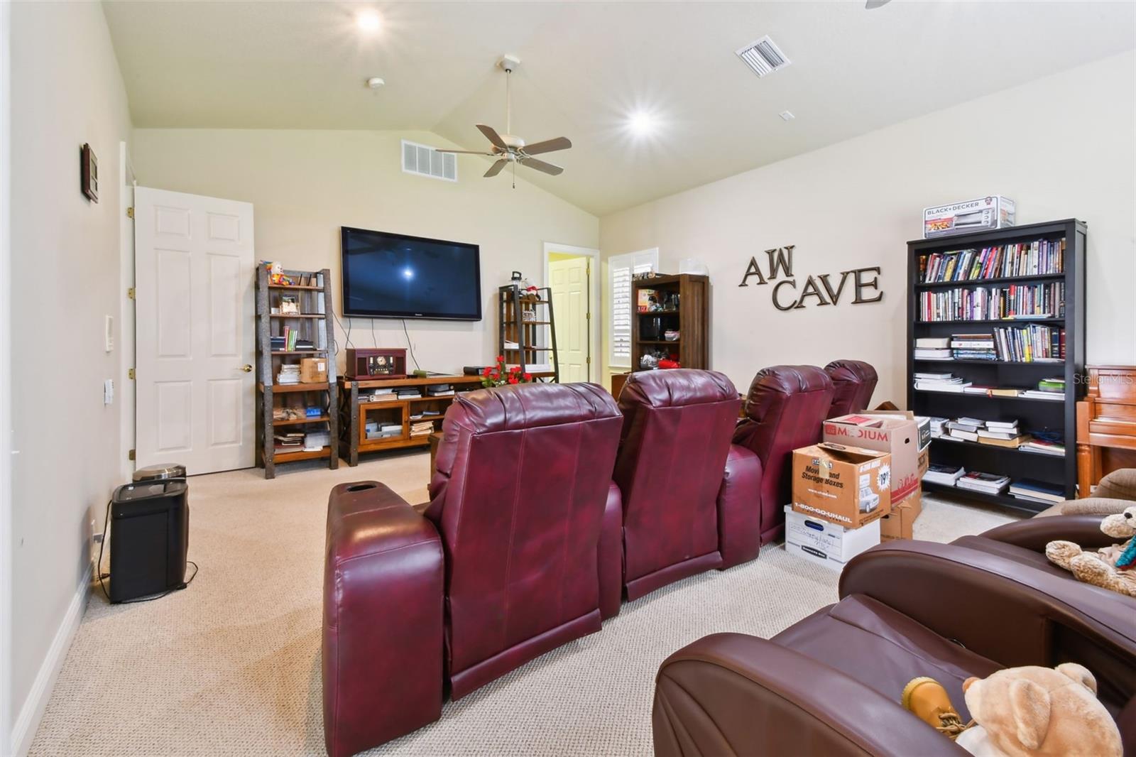Media/Bonus room with a large storage closet.