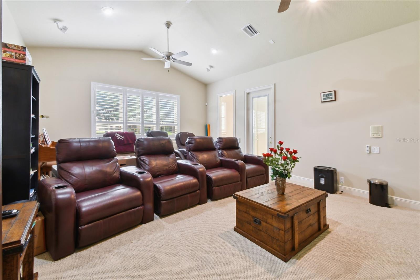 Bonus/Media room at the rear of the home with access out to the pool.