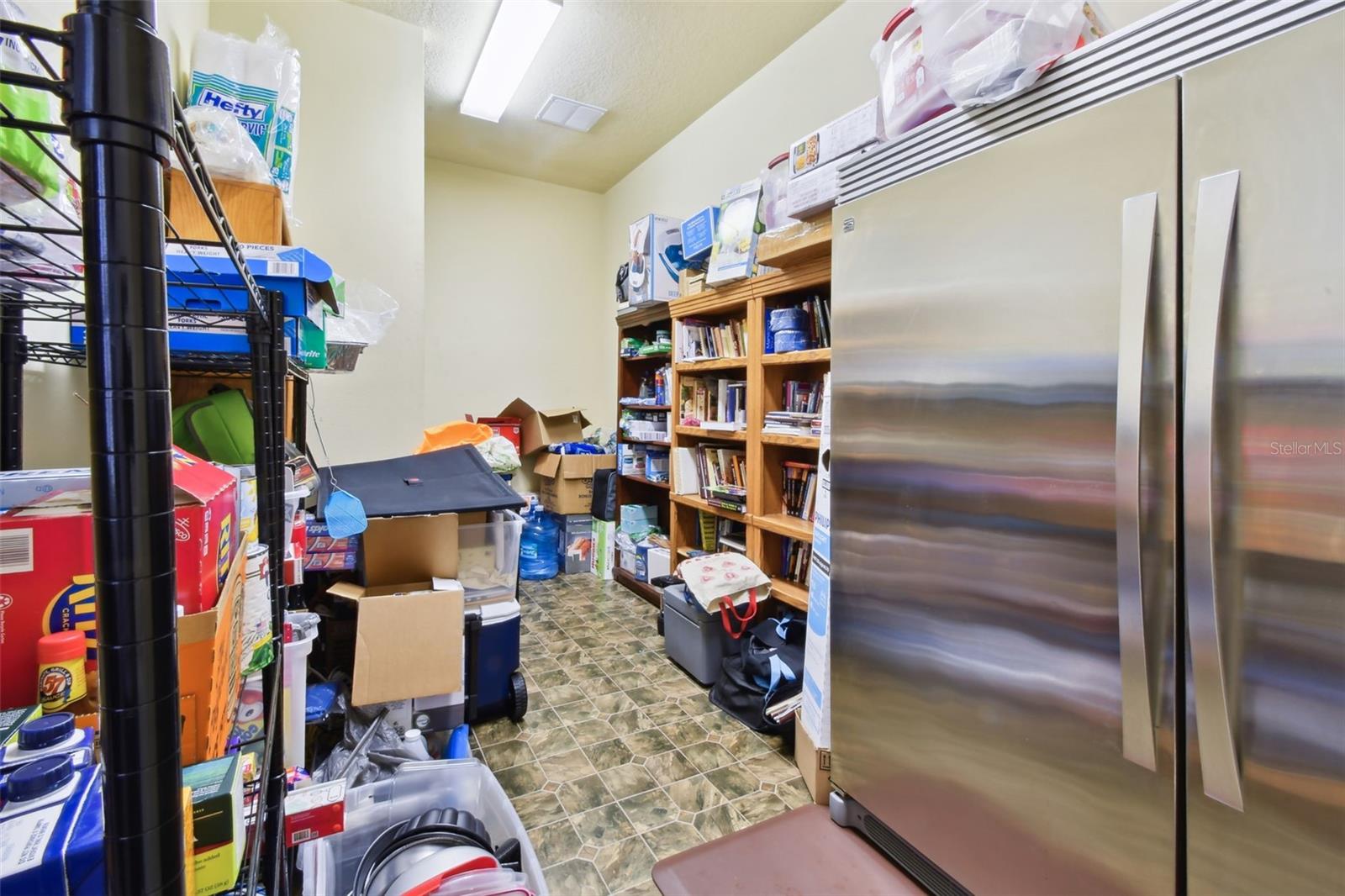 Large storage room which is used as an additional pantry off the bonus/media room.